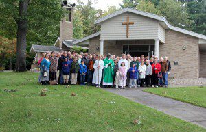 Our Lady of Assumption Chapel with group in front